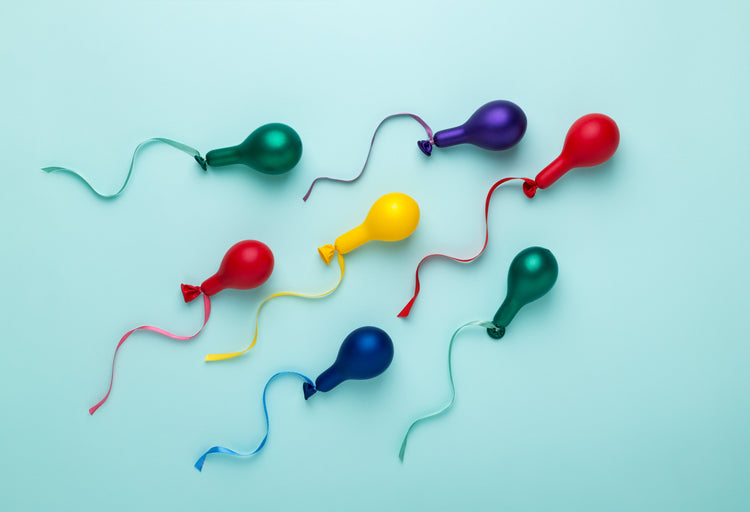 deflated balloons shaped as sperm