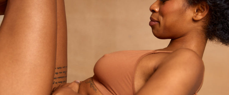black woman holding stomach